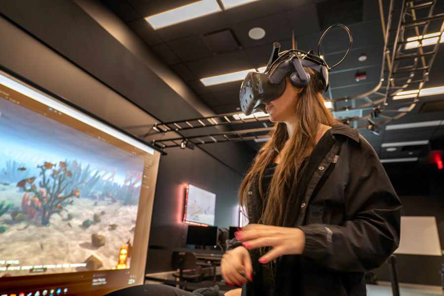 Student Sofia Synychych using VR equipment