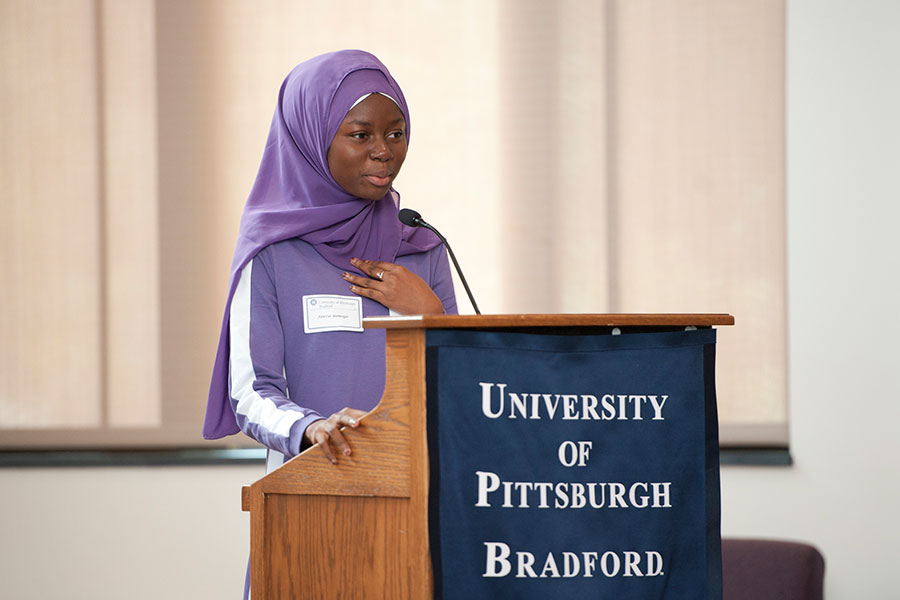 Fawzia Yameogo speaking at podium