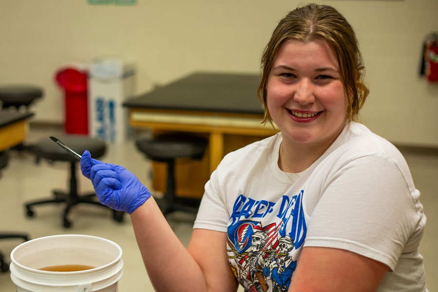 Student holding a scapel