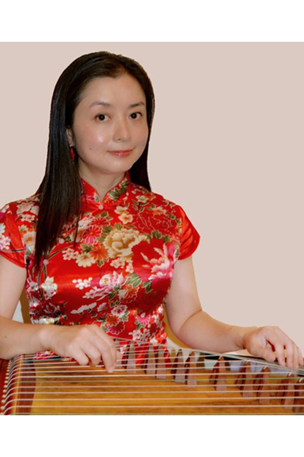 A photo of Daisy Wu playing the chinese zither
