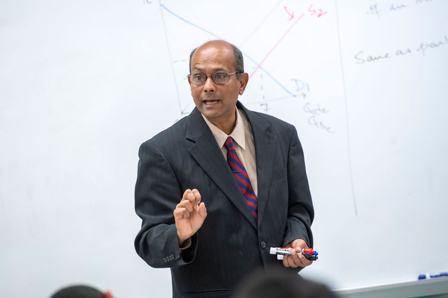 Dr. Gajanan teaching an economics class