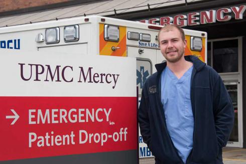 Zach Hadfield in front of emergency room