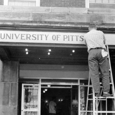 University of Pittsburgh at Bradford lettering being installed on a building